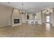 Open living area featuring tile floors and a fireplace at 36549 N Porta Nuova Rd, Scottsdale, AZ 85262