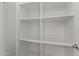 White shelving pantry with adjustable shelves at 36549 N Porta Nuova Rd, Scottsdale, AZ 85262