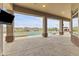 Spacious covered patio with pool and mountain views at 36549 N Porta Nuova Rd, Scottsdale, AZ 85262