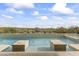 Inviting pool and spa with seating and desert views at 36549 N Porta Nuova Rd, Scottsdale, AZ 85262