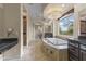 Spa-like Primary bath with a large soaking tub and double vanities at 36549 N Porta Nuova Rd, Scottsdale, AZ 85262