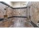 Spacious walk-in shower with dual shower heads and built-in seat at 36549 N Porta Nuova Rd, Scottsdale, AZ 85262