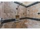 Walk-in shower with built-in seat and tiled walls at 36549 N Porta Nuova Rd, Scottsdale, AZ 85262