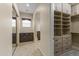 Large walk-in closet with ample shelving and drawers at 36549 N Porta Nuova Rd, Scottsdale, AZ 85262