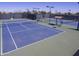 Multiple well-maintained tennis courts at 42432 W Abbey Rd, Maricopa, AZ 85138