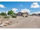 House exterior showcasing a large yard and driveway at 43759 N Terrace View Ave, San Tan Valley, AZ 85140