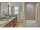 Bathroom with double vanity, granite countertop, and tub at 5201 N 18Th Pl, Phoenix, AZ 85016