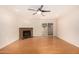 Living room with hardwood floors, fireplace, and sliding door at 645 N Beck Ave, Chandler, AZ 85226