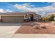 Two-car garage, neutral exterior and nicely landscaped front yard at 6823 W Williams Dr, Glendale, AZ 85310