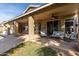 Covered patio offers comfortable seating and overlooks the pool at 6823 W Williams Dr, Glendale, AZ 85310