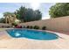 Inviting kidney-shaped pool with ample surrounding patio space at 6823 W Williams Dr, Glendale, AZ 85310