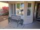 Inviting front porch with bench and planters at 717 S 123Rd Dr, Avondale, AZ 85323