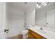 Clean bathroom with tub, toilet, and wood vanity at 826 E Bradstock Way, San Tan Valley, AZ 85140