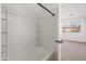 Bathroom with shower/tub combo and built-in shelving at 826 E Bradstock Way, San Tan Valley, AZ 85140