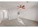 Spacious bedroom with a ceiling fan and loft area at 826 E Bradstock Way, San Tan Valley, AZ 85140