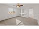 Bright bedroom with a ceiling fan and built-in shelves at 826 E Bradstock Way, San Tan Valley, AZ 85140