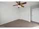 Bright bedroom with ceiling fan and double door closet at 826 E Bradstock Way, San Tan Valley, AZ 85140