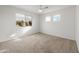 Well-lit bedroom with ceiling fan and window at 826 E Bradstock Way, San Tan Valley, AZ 85140