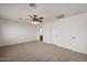 Bright bedroom with ceiling fan and access to bathroom at 826 E Bradstock Way, San Tan Valley, AZ 85140