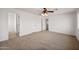 Bedroom with carpet, ceiling fan, and multiple doors at 826 E Bradstock Way, San Tan Valley, AZ 85140
