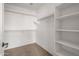 Spacious walk-in closet with shelving and hanging rods at 826 E Bradstock Way, San Tan Valley, AZ 85140