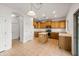 Kitchen with wood cabinets, island, and tiled floor at 826 E Bradstock Way, San Tan Valley, AZ 85140
