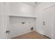 Laundry room with tile flooring and built-in shelving at 826 E Bradstock Way, San Tan Valley, AZ 85140