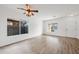 Spacious living room featuring hardwood floors and neutral walls at 826 E Bradstock Way, San Tan Valley, AZ 85140