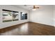 Living room with hardwood floors and large windows at 826 E Bradstock Way, San Tan Valley, AZ 85140