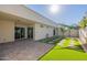 Spacious backyard with patio, artificial turf, and shade sail at 8642 E Monterosa Ave, Scottsdale, AZ 85251