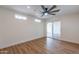 Well-lit bedroom with ceiling fan, sliding door to patio, and hardwood floors at 8642 E Monterosa Ave, Scottsdale, AZ 85251