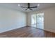 Bright bedroom with wood floors, sliding door to patio, and ceiling fan at 8642 E Monterosa Ave, Scottsdale, AZ 85251