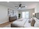 Main bedroom with king bed, two abstract art pieces, and access to a private patio at 8642 E Monterosa Ave, Scottsdale, AZ 85251