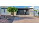 Mid-century home with carport and a landscaped front yard at 8642 E Monterosa Ave, Scottsdale, AZ 85251