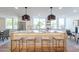 Modern kitchen with a large island, breakfast bar, and high-end stainless steel appliances at 8642 E Monterosa Ave, Scottsdale, AZ 85251