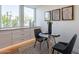 Cozy kitchen nook with a glass-top table and modern chairs, perfect for casual dining at 8642 E Monterosa Ave, Scottsdale, AZ 85251