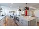 Modern kitchen boasts a large island with a marble countertop and stainless steel appliances at 8642 E Monterosa Ave, Scottsdale, AZ 85251
