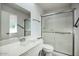 Bathroom with shower stall, toilet, and single vanity sink at 9841 N Balboa Dr, Sun City, AZ 85351