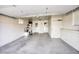 Two-car garage with storage shelving and extra space at 9841 N Balboa Dr, Sun City, AZ 85351