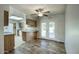 Kitchen boasts wood cabinets, tile flooring, and access to backyard patio at 9841 N Balboa Dr, Sun City, AZ 85351