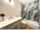 Modern bathroom with a marble-look shower and vanity at 10080 E Mountain View Lake Dr # 140, Scottsdale, AZ 85258