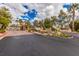 Gated community entrance with landscaping and signage at 10080 E Mountain View Lake Dr # 140, Scottsdale, AZ 85258