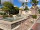 Community entrance with a fountain and stone accents at 10080 E Mountain View Lake Dr # 140, Scottsdale, AZ 85258