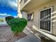 Condo exterior with security door and landscaping at 10080 E Mountain View Lake Dr # 140, Scottsdale, AZ 85258