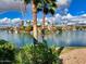 Stunning lake view with boats and lush landscaping at 10080 E Mountain View Lake Dr # 140, Scottsdale, AZ 85258