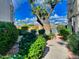 Landscaped walkway leads to a lakefront view at 10080 E Mountain View Lake Dr # 140, Scottsdale, AZ 85258