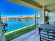 Covered patio with lake view and seating at 10080 E Mountain View Lake Dr # 140, Scottsdale, AZ 85258