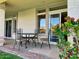 Covered patio features a table and chairs, perfect for outdoor dining at 10080 E Mountain View Lake Dr # 140, Scottsdale, AZ 85258