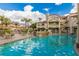 Community pool with surrounding patio furniture at 10080 E Mountain View Lake Dr # 140, Scottsdale, AZ 85258