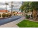 Landscaped entrance to a community with palm trees at 10080 E Mountainview Lake Dr # 242, Scottsdale, AZ 85258